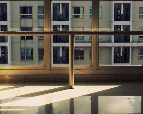 Sunlight streaming through urban apartment window