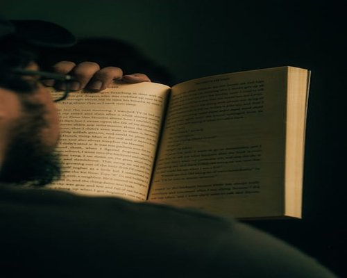 Reading a book in dim lighting setup